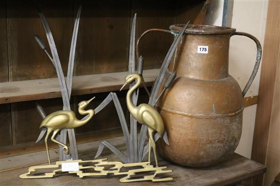 A brass and iron group of storks and an Eastern copper pot